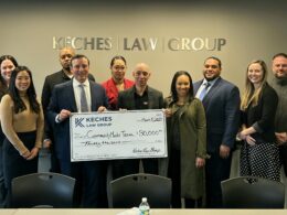 Keches Law Group and Community Mentoring Team leaders celebrate their partnership by posing with a donation check from Keches.