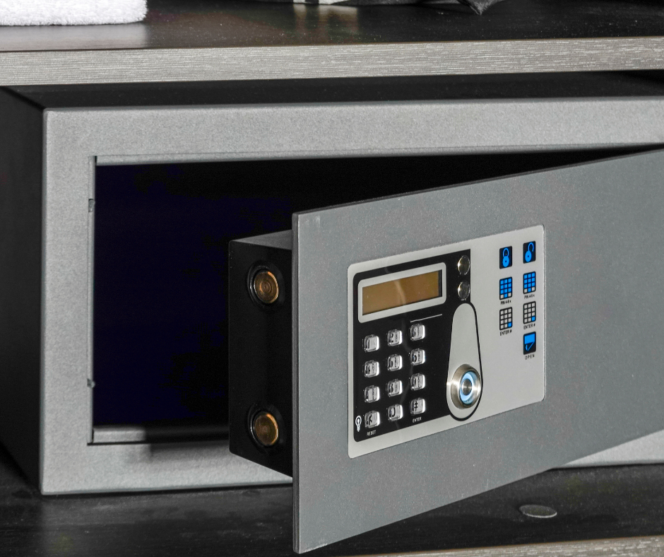 A fireproof safe that is slightly opened with a numeric keypad.